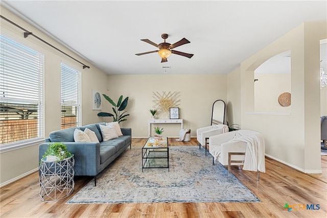 living room with ceiling fan and hardwood / wood-style floors