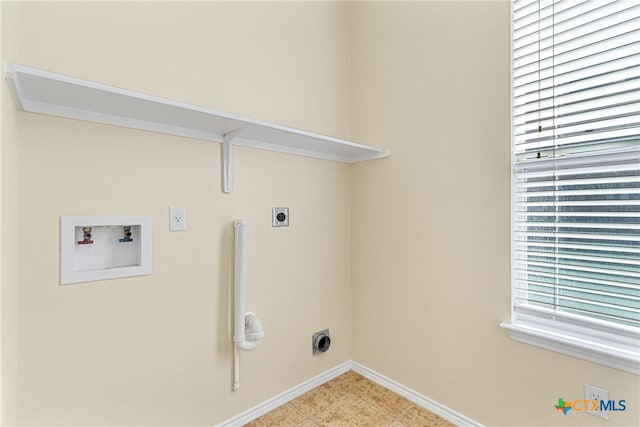 laundry area featuring hookup for a washing machine, plenty of natural light, light tile patterned flooring, and hookup for an electric dryer