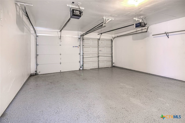 garage featuring a garage door opener