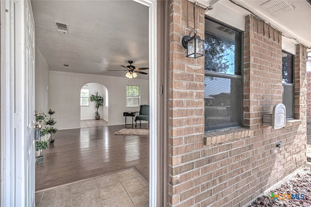 exterior space featuring ceiling fan