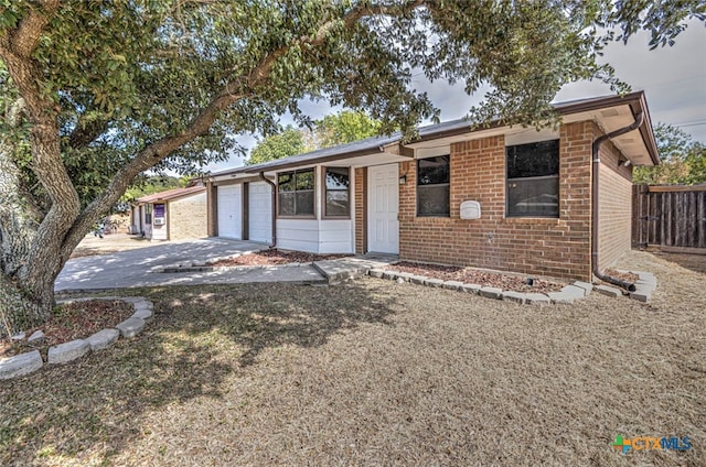 ranch-style home featuring a garage