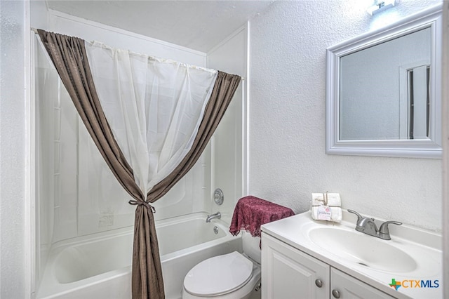 full bathroom featuring vanity, shower / bath combo with shower curtain, and toilet