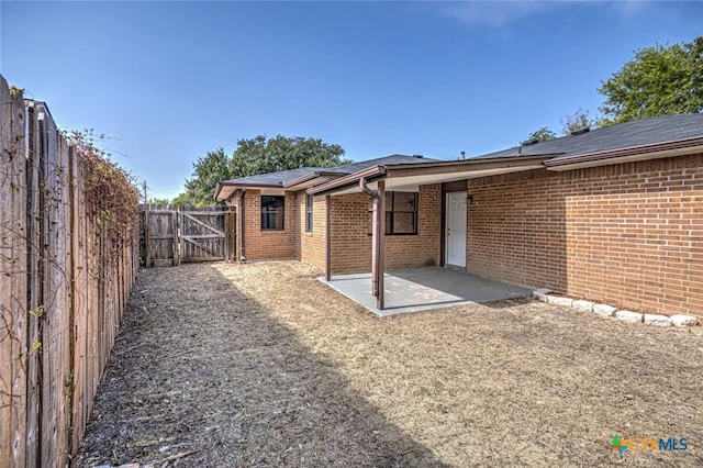 back of house featuring a patio area