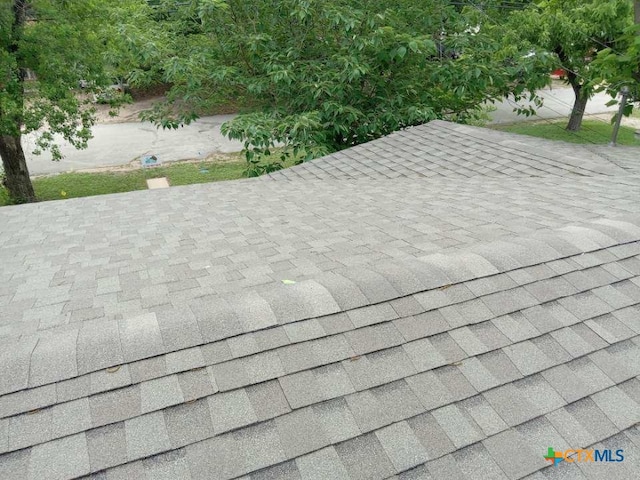 details featuring a shingled roof