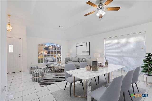 dining area featuring light tile patterned floors, ceiling fan, and lofted ceiling