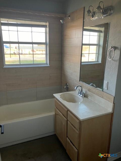 full bath featuring shower / bath combination and vanity