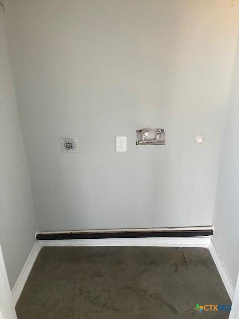 laundry area featuring baseboards, hookup for a washing machine, and laundry area