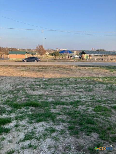 view of yard with a rural view