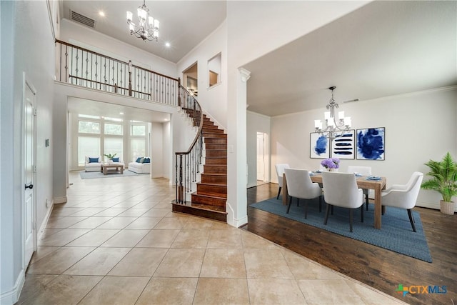 934 Wilderness Trl, New Braunfels, TX 78132 - tiled dining area with a chandelier, stairs, baseboards, ornamental molding, and recessed lighting