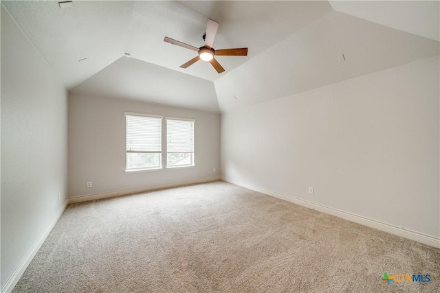 934 Wilderness Trl, New Braunfels, TX 78132 - empty room featuring ceiling fan, carpet, lofted ceiling, and baseboards