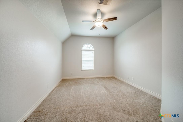 934 Wilderness Trl, New Braunfels, TX 78132 - empty room with light colored carpet, ceiling fan, lofted ceiling, and baseboards