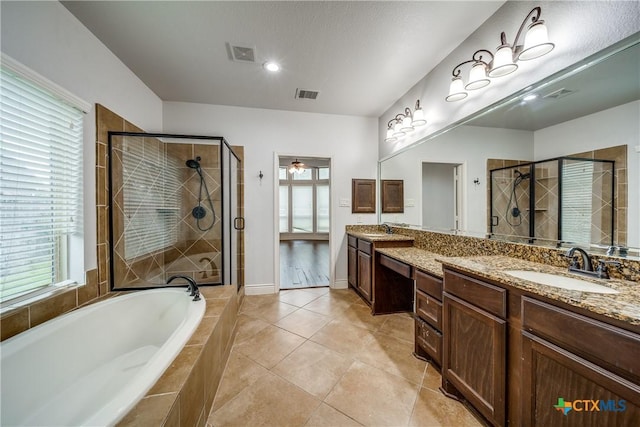 934 Wilderness Trl, New Braunfels, TX 78132 - full bath featuring a shower stall, a bath, vanity, tile patterned floors, and recessed lighting