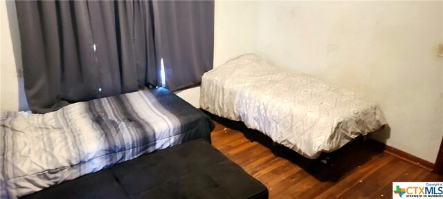 bedroom featuring dark hardwood / wood-style floors