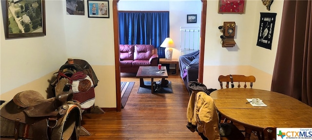 dining space featuring dark wood-type flooring