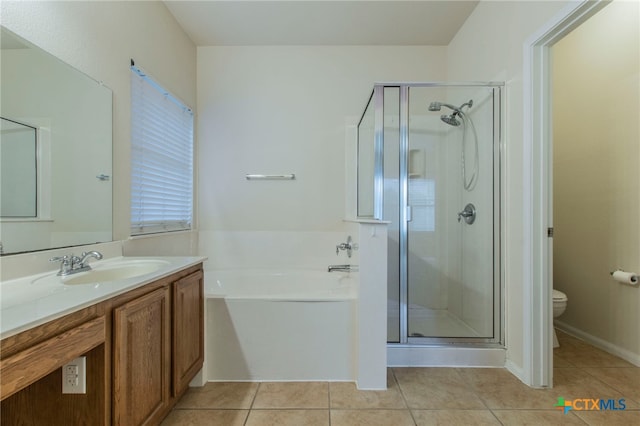 612 Weeping Willow Dr, Temple, TX 76502 - bathroom featuring tile patterned floors, a bath, a shower stall, and vanity