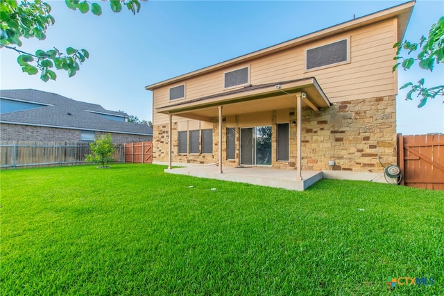 612 Weeping Willow Dr, Temple, TX 76502 - rear view of house featuring a patio area, a fenced backyard, and stone siding