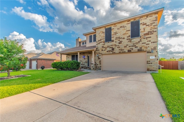 612 Weeping Willow Dr, Temple, TX 76502 - traditional-style house featuring stone siding, a garage, concrete driveway, and a chimney
