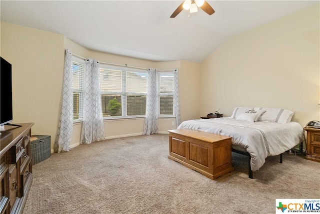 bedroom with light colored carpet, vaulted ceiling, ceiling fan, and baseboards