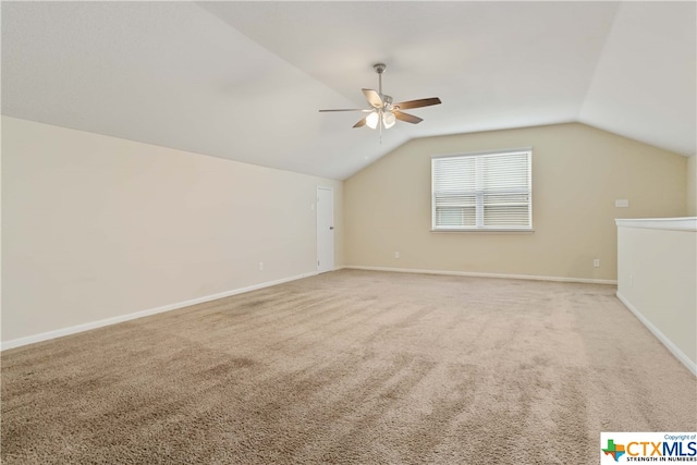 bonus room featuring carpet, vaulted ceiling, and ceiling fan