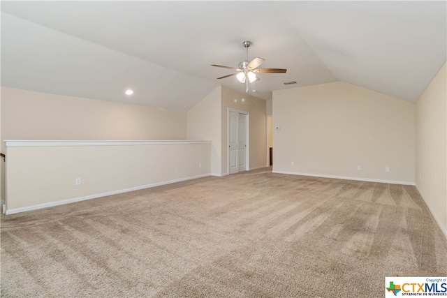 bonus room featuring ceiling fan, light colored carpet, and lofted ceiling