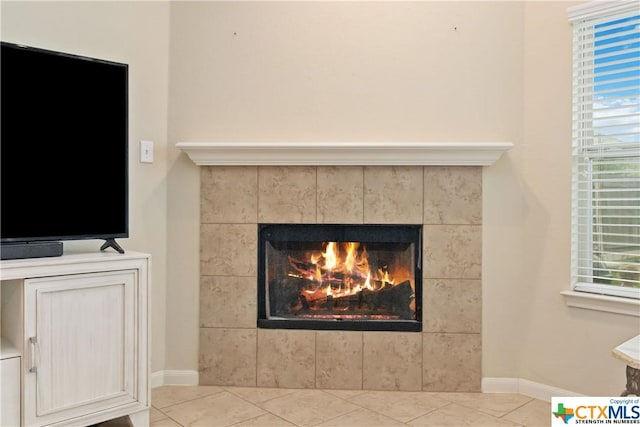detailed view of a tile fireplace and baseboards