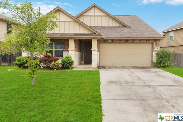 view of front of property with a garage and a front yard