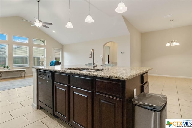 kitchen featuring dishwasher, a sink, light tile patterned floors, vaulted ceiling, and a ceiling fan