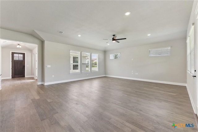 264 Sweeping Sage Ln, San Marcos, TX 78666 - unfurnished living room with ceiling fan, healthy amount of natural light, dark wood-style floors, baseboards, and recessed lighting