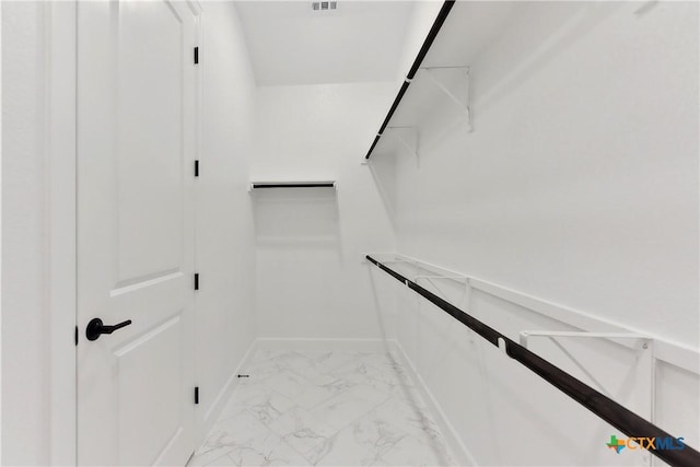 264 Sweeping Sage Ln, San Marcos, TX 78666 - walk in closet featuring light marble finish floors