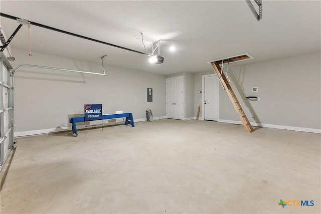 264 Sweeping Sage Ln, San Marcos, TX 78666 - garage featuring a garage door opener, electric panel, and baseboards