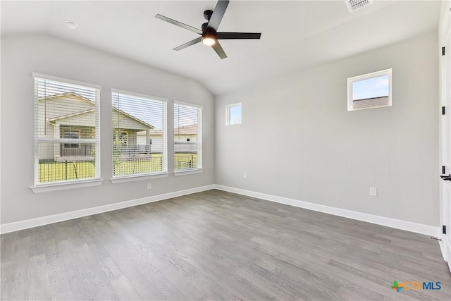264 Sweeping Sage Ln, San Marcos, TX 78666 - unfurnished room featuring lofted ceiling, wood finished floors, a ceiling fan, and baseboards