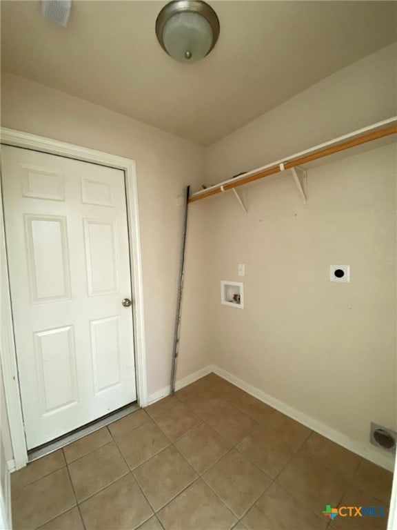 washroom with washer hookup, light tile patterned floors, and electric dryer hookup