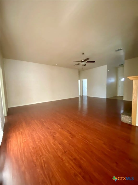 empty room featuring wood-type flooring and ceiling fan