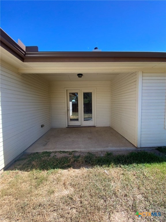 entrance to property with a patio area