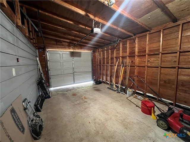 garage featuring a garage door opener