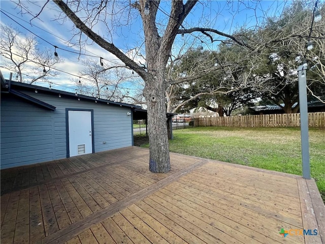 wooden deck with fence and a yard