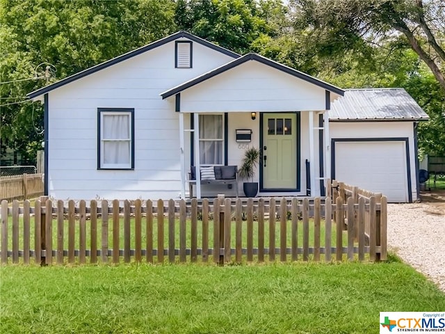 view of front of property with a garage and a front yard