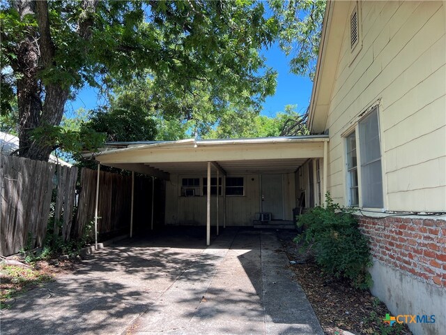 exterior space featuring a carport