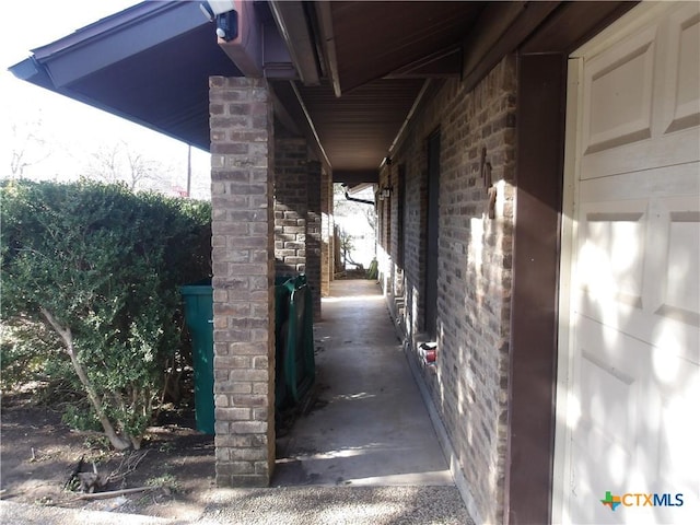 view of property exterior featuring brick siding