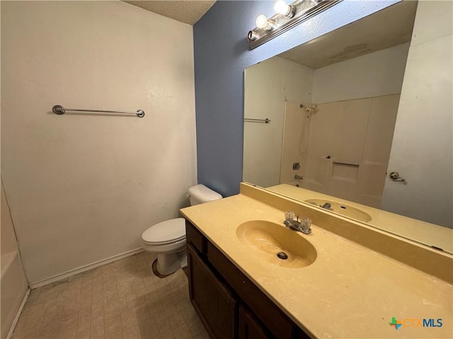 bathroom with shower / tub combination, vanity, toilet, and baseboards