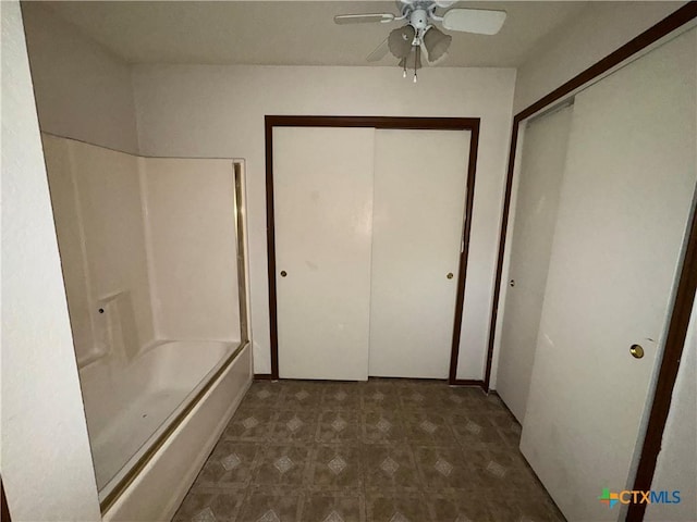 full bath with ceiling fan, bathing tub / shower combination, and tile patterned floors