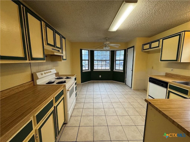 kitchen with light tile patterned floors, a ceiling fan, a textured ceiling, white appliances, and under cabinet range hood