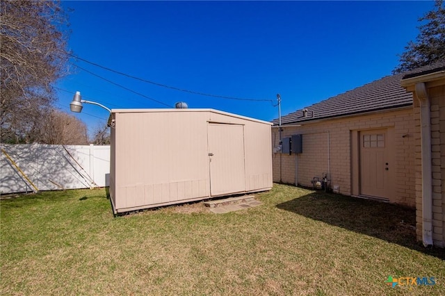 view of shed with fence