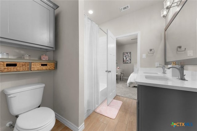 bathroom with vanity and toilet