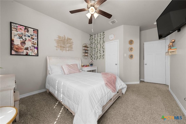 carpeted bedroom with ceiling fan