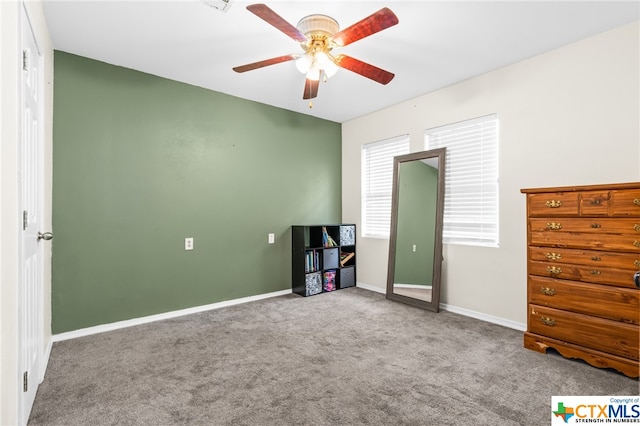 unfurnished bedroom featuring carpet flooring and ceiling fan