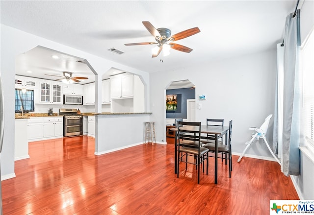 dining room featuring light wood-type flooring and ceiling fan