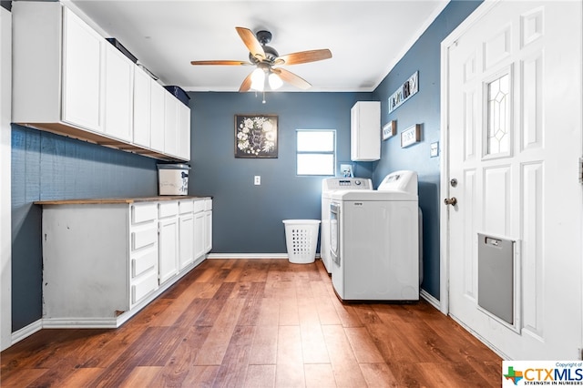 laundry area featuring washer and dryer, dark hardwood / wood-style flooring, cabinets, and ceiling fan