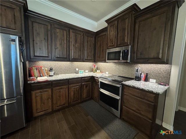 kitchen featuring stainless steel appliances, dark wood-style flooring, dark brown cabinets, ornamental molding, and tasteful backsplash