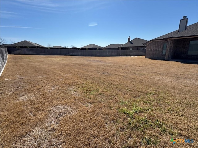 view of yard featuring fence